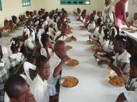 Elementary students enjoying their meal