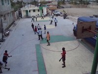 Students and neighboring kids alike enjoy the court