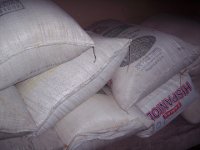 Piling Bags of Rice and Beans at the Storage