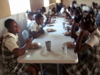 Older Students Eating Rice and Beans at the Cafeteria