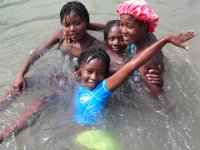 Girls Enjoy Bathing in the River During Camp Week