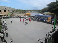 High School Boys Playing Basketball During Recess