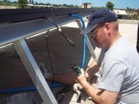 Randy Carroll Working on Intalling the Solar Panels at Living Water