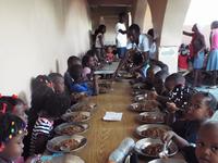 Little Kids Enjoying their Meals After their Camp Activities