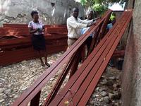 Rosemond and Monexant Trying to Lift a Truss for the Roof of the Church