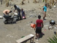 School principal pushing wheelbarrow