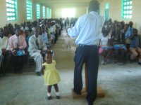 Daddy preaching and his girl parading