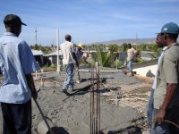 Men spreading the concrete