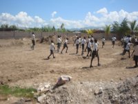 Boys eagerly chasing the soccer ball