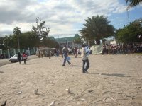 Fevrier (left) and Manno (right) distribute water to the people