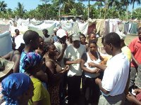 Refugees receive cards for the distribution