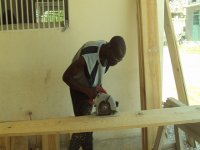 Robin building benches for the new school year