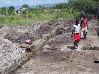 Kids visiting the progress of the foundation of the clinic