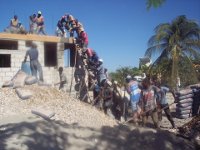 Pouring Concrete on the Eastern Roof of the Transitional Church Building