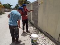 Josh and Richard of I68 Painted the Outside Wall of the School Campus